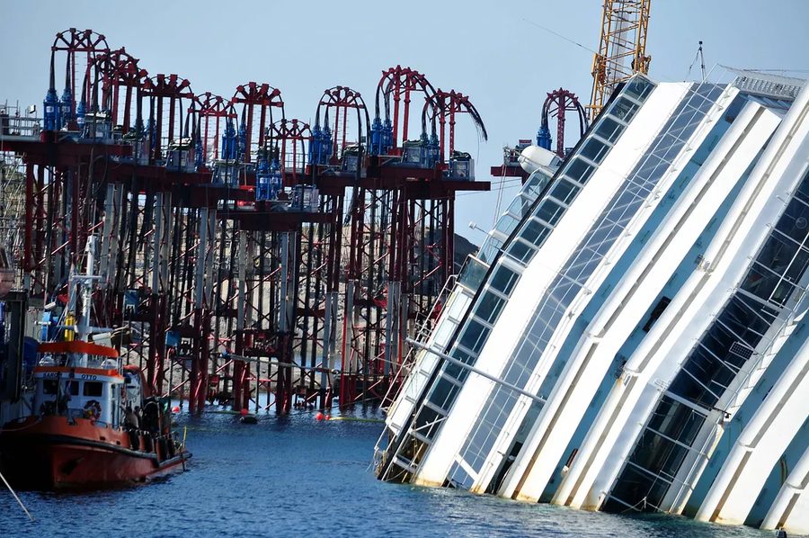 Rows of strand jack towers on the salvage platform beside the capsized Costa Concordia at Isola del Giglio, shortly before the September 2013 parbuckling operation.