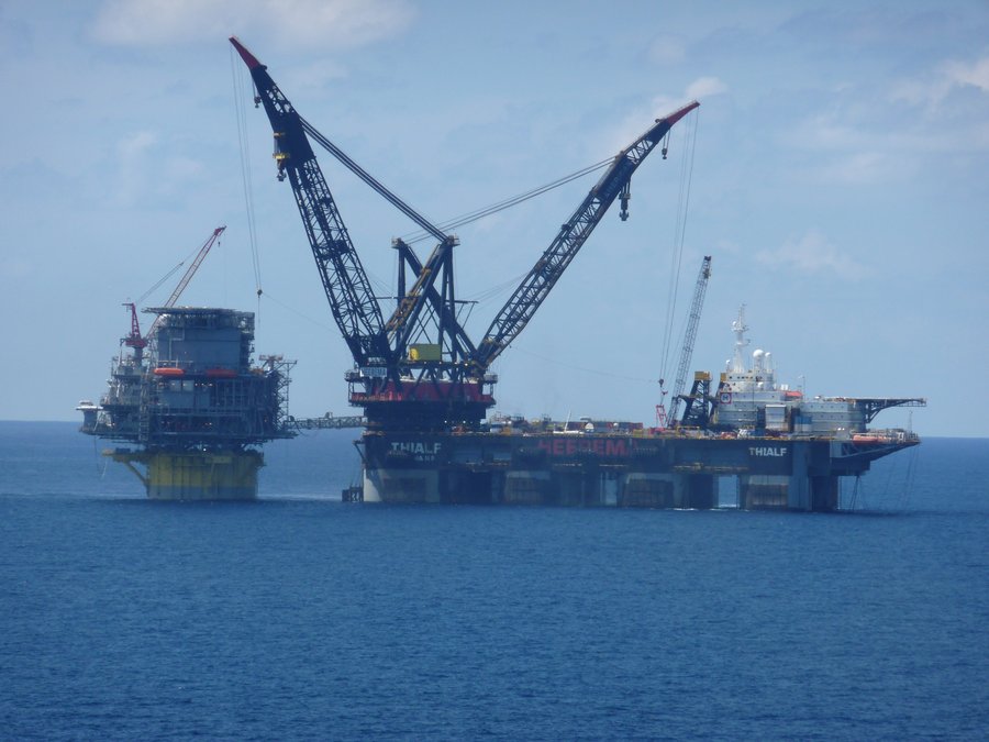 The semi-submersible crane vessel Thialf moored alongside the Perdido spar platform in the Gulf of Mexico during installation