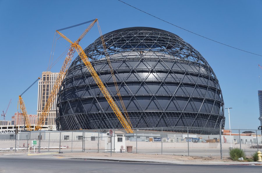 The Sphere at The Venetian in Las Vegas under construction, September 2022, showing its exposed geodesic steel structure with two large cranes alongside