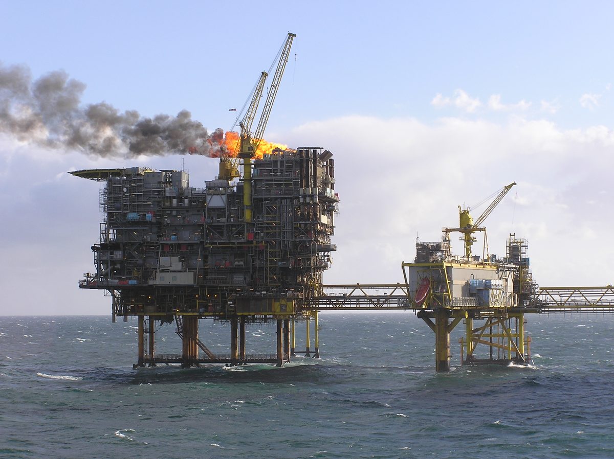 The Tyra East offshore platforms in the Danish North Sea in 2006, with a flare burning and a bridge linking two platforms